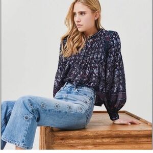 Re/Done Women's 70s Loose Flare Jean is vintage-inspired  embellished raw hem 29